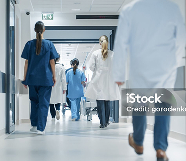 medical-staff-walking-hospital-hallway.jpg